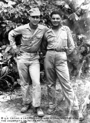 Eliseo Lopez (right) and fellow soldier Sortorio stand against the backdrop of the jungle in Bouganville, 1944.