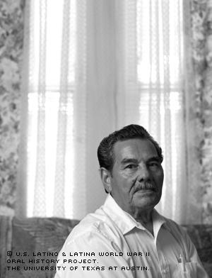 Eliseo Lopez sits in the living room of his Austin, Texas home in an April 2001 portrait. (Photo by Alan K. Davis)