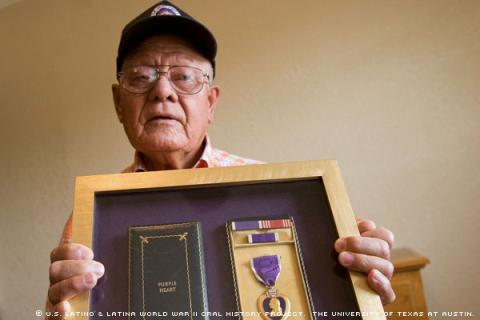 Manuel Vera, holding his framed Purple Heart medal, photographed at his home in El Paso, Texas, May 2008. (Photo By: Valentino Mauricio)