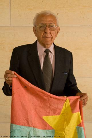 Luis Landin displays a Viet Cong flag at the AT&T Executive and Conference Center, University of Texas, Austin on Saturday, October 3, 2009. Mr. Landin attended our 10th anniversary and was interviewed by Raquel Garza. (Photo: Marc Hamel)