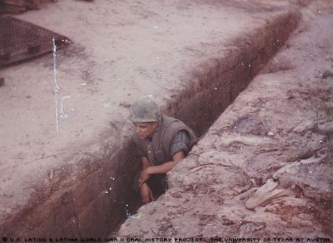 Robert Alonzo Rivera waiting for NVA to come out of a tunnel in Khe Sanh, Vietnam, 1968.