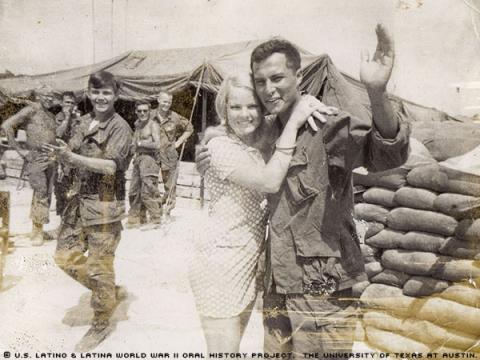 Henry Soza photographed with a Donut Dollie Red Cross volunteer in Vietnam on April 21, 1969.