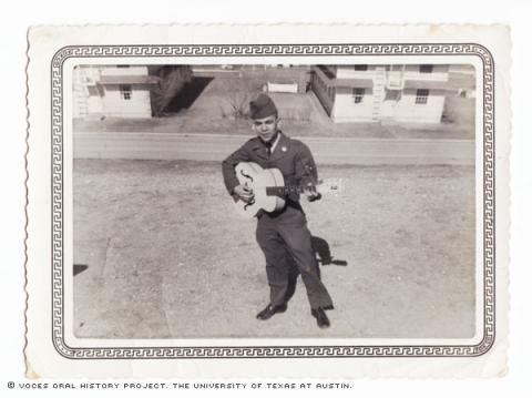 Placindo Salazar in 1957 at the Francis E. Warren AFB in Cheyenne, Wyoming.\Playing my guitar and singing for my friends (air force buddies).\""