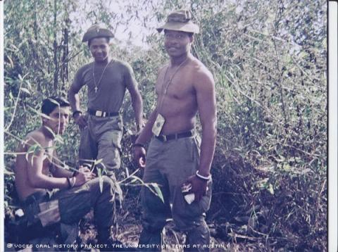 Dan Hinojosa sitting, Lloyd Bryant middle, Gus Mack right...Dan Hinojosa, Gus Mack, and Lloyd Bryant in the Ashua Valley in North Vietnam, December of 1969. They were on patrol and stopped to eat and set up for the night.
