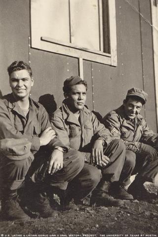 From left to right, Copper, Rafael, and Riley. This photo was taken at Camp Beale in 1943. They are taking a break after a training section. These two men were his\two pals\"who were great at helping improve Rafael's English."